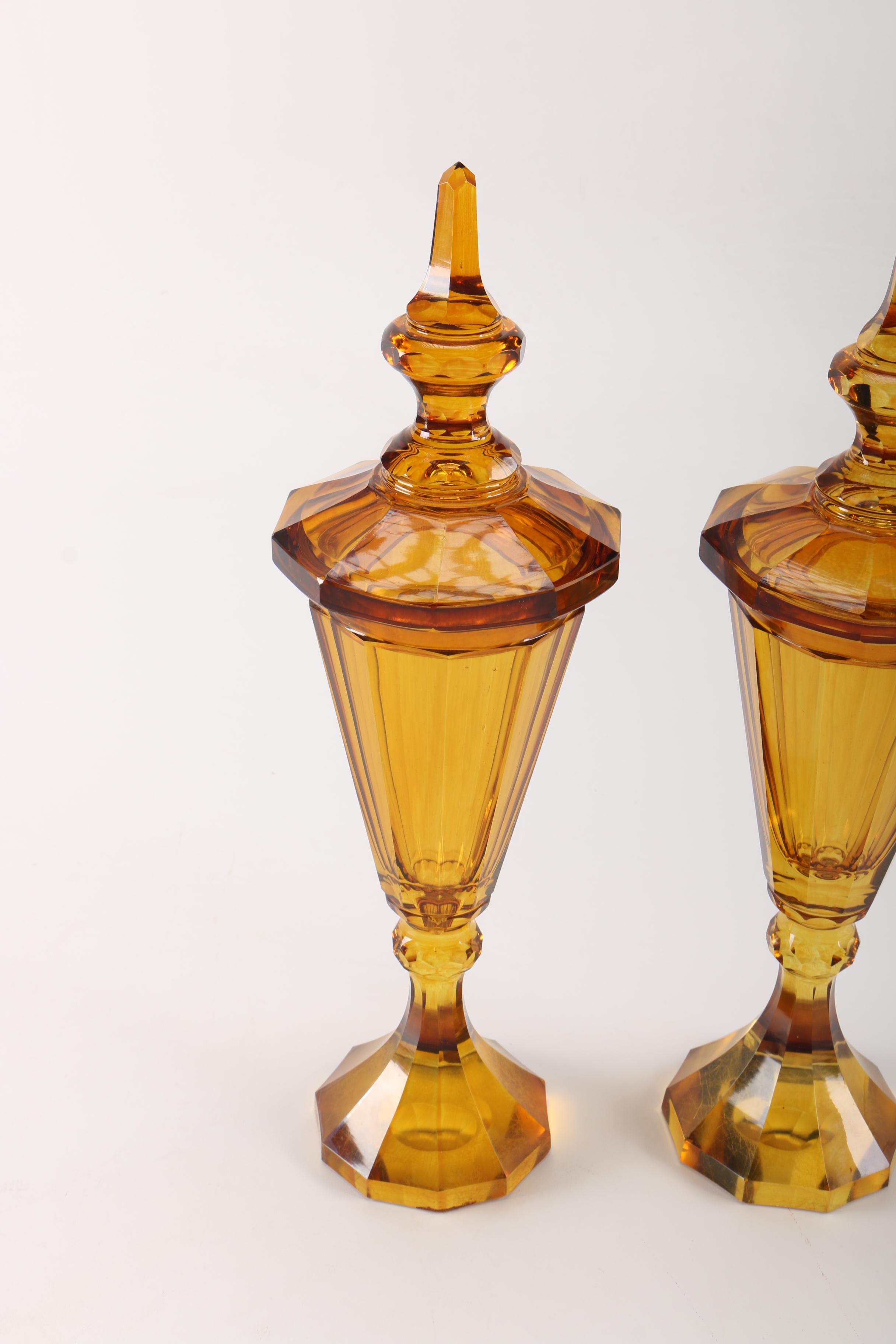Pair of Amber-Colored Glass Lidded Urns
