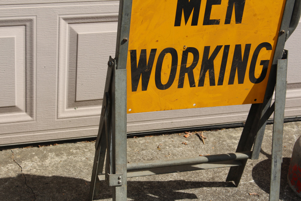 Vintage Metal "Men Working" Sign With Gas Can