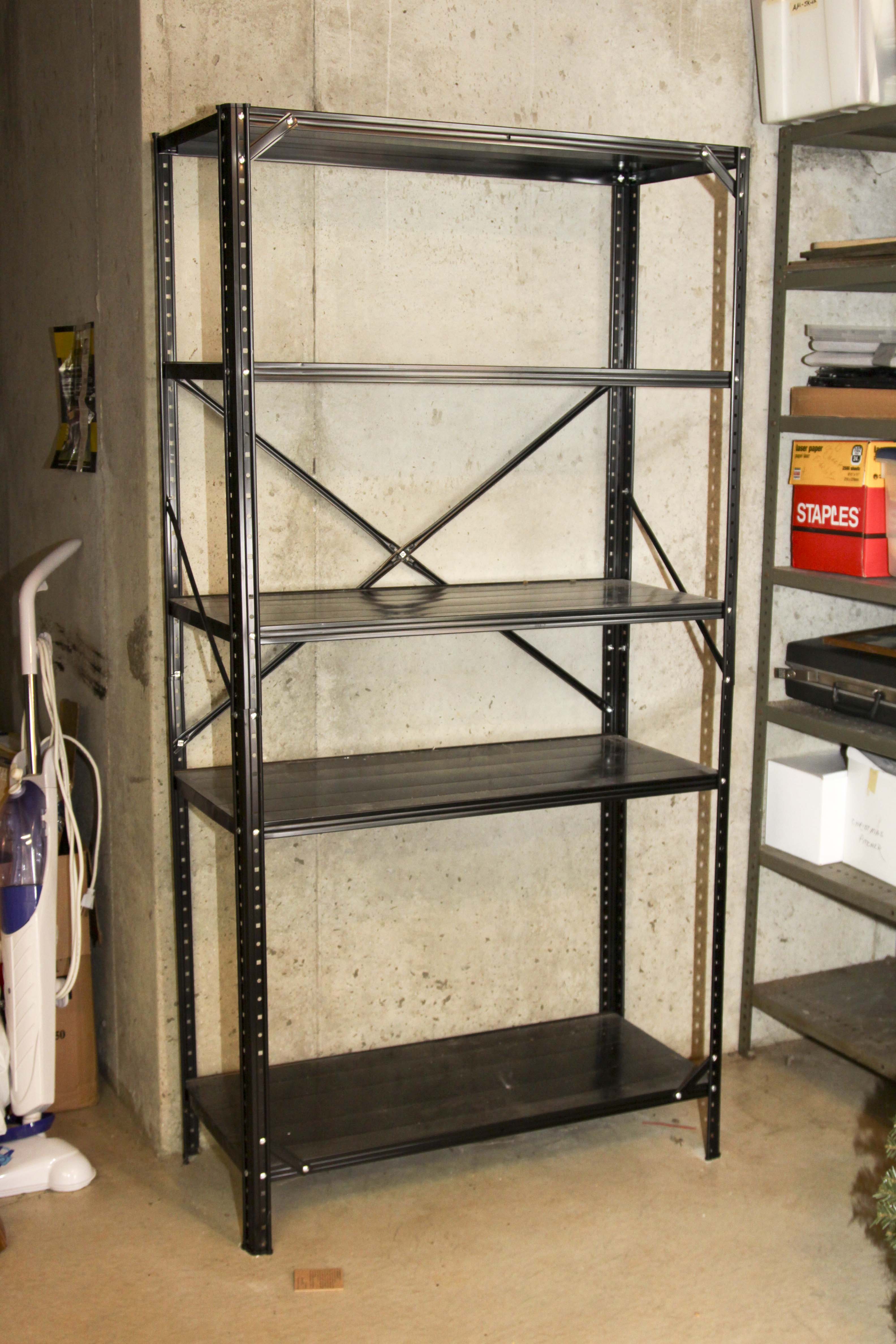 Four Black Metal Shelving Units