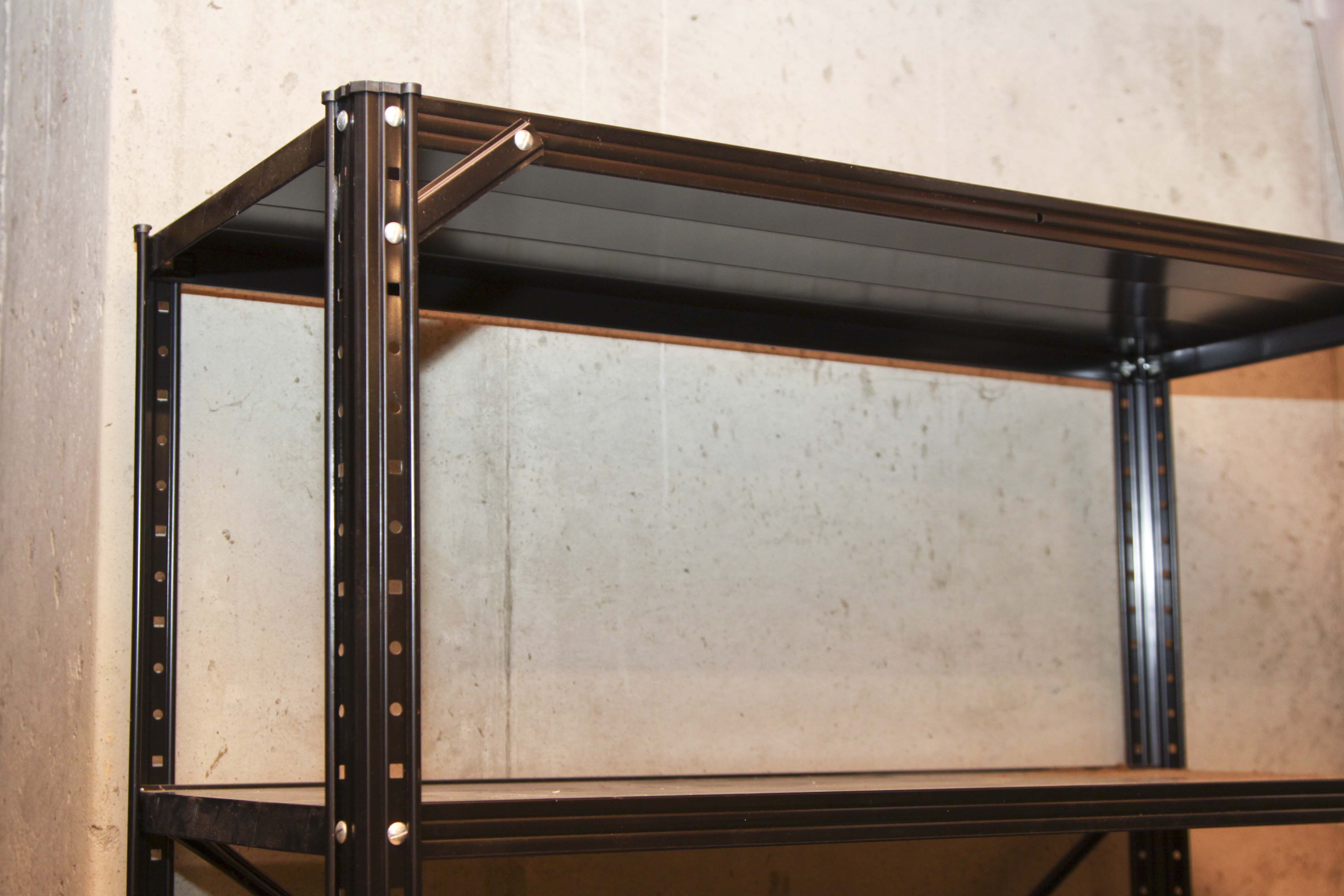 Four Black Metal Shelving Units