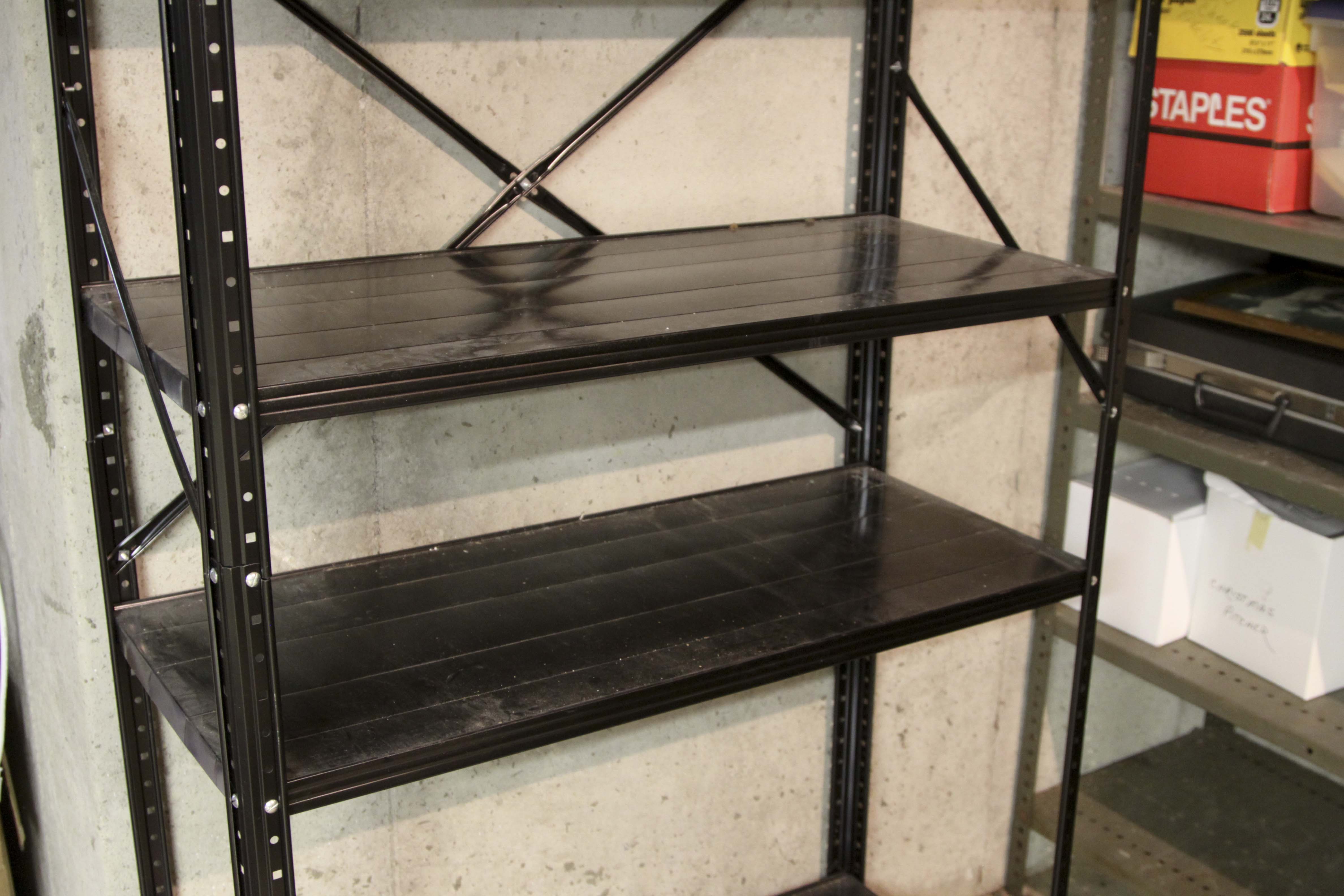 Four Black Metal Shelving Units