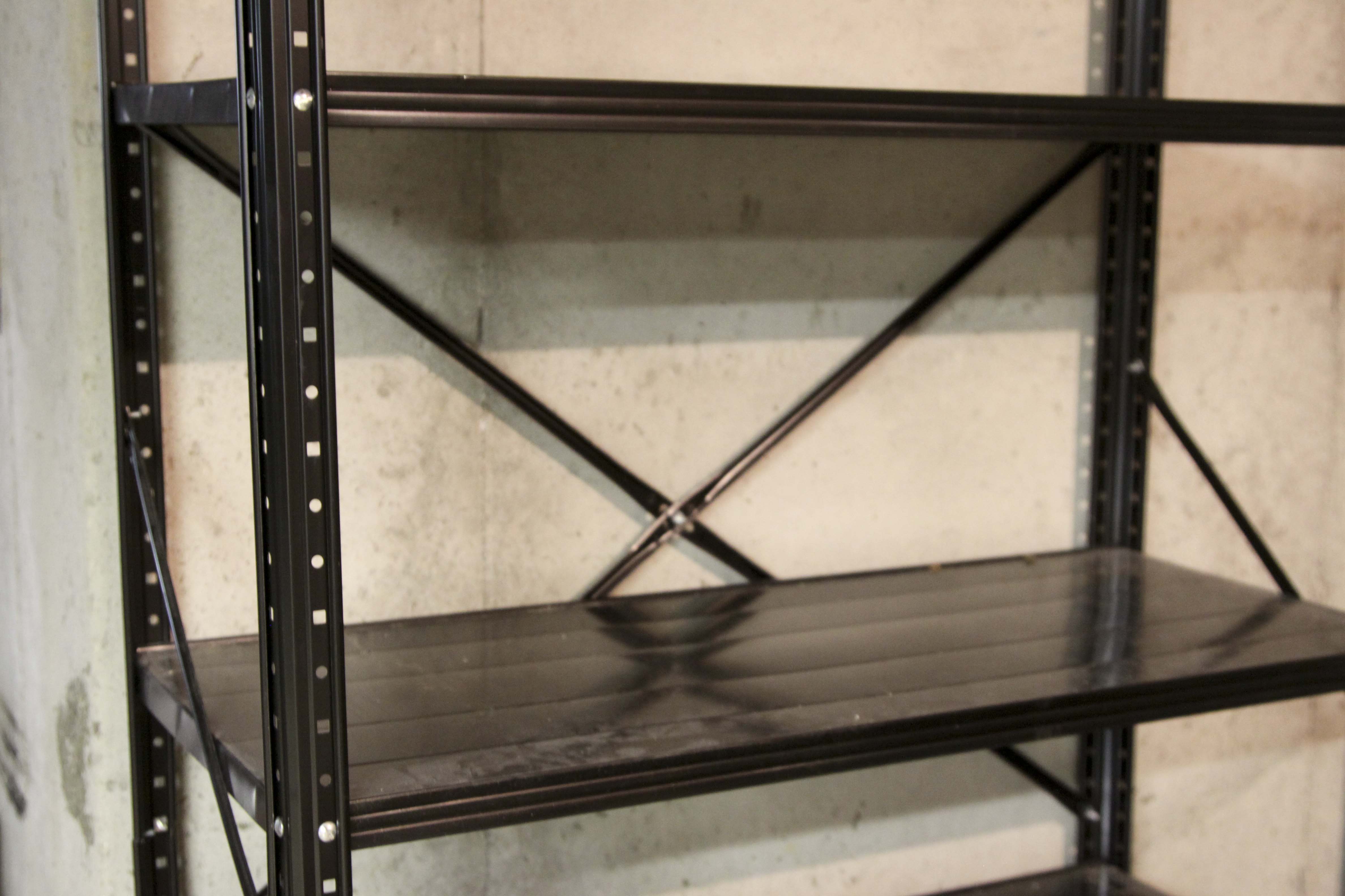 Four Black Metal Shelving Units