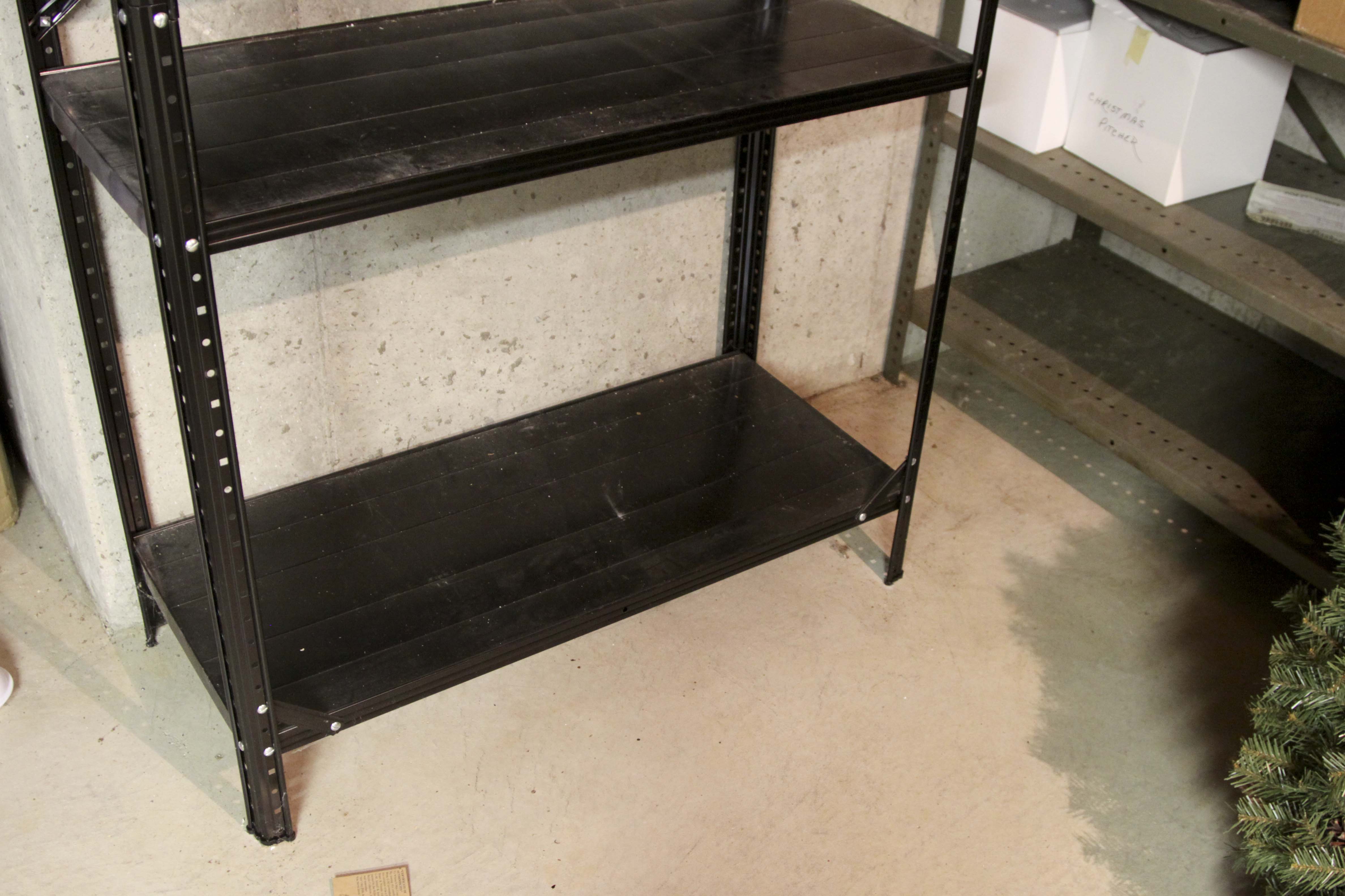 Four Black Metal Shelving Units