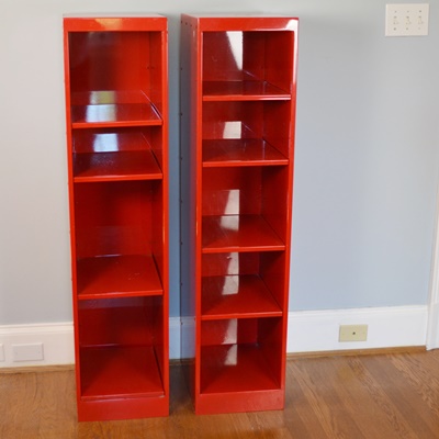 Two Red Metal Shelf Units