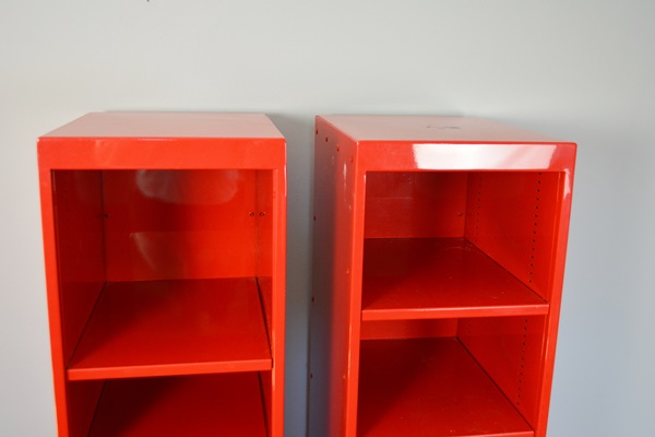 Two Red Metal Shelf Units
