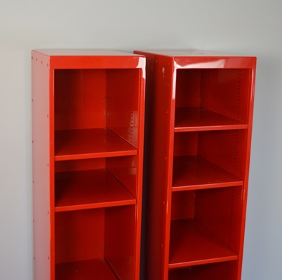 Two Red Metal Shelf Units
