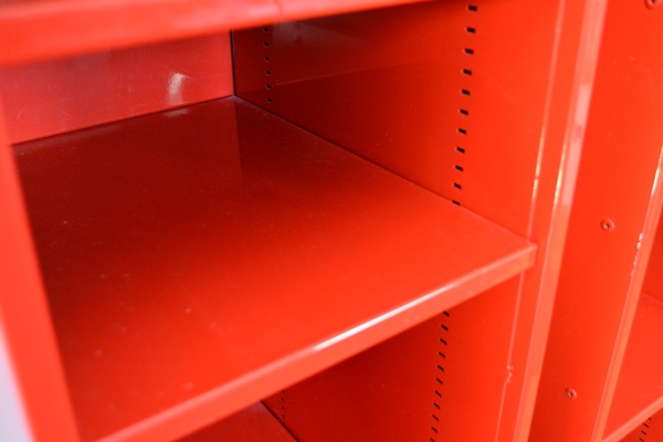 Two Red Metal Shelf Units