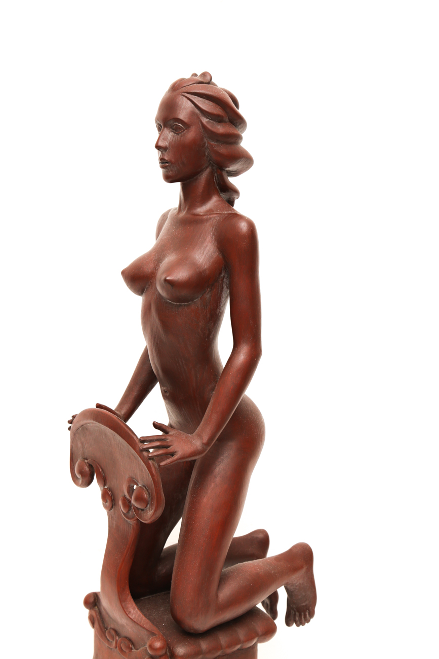 Hand Carved Sculpture Of A Female Kneeling