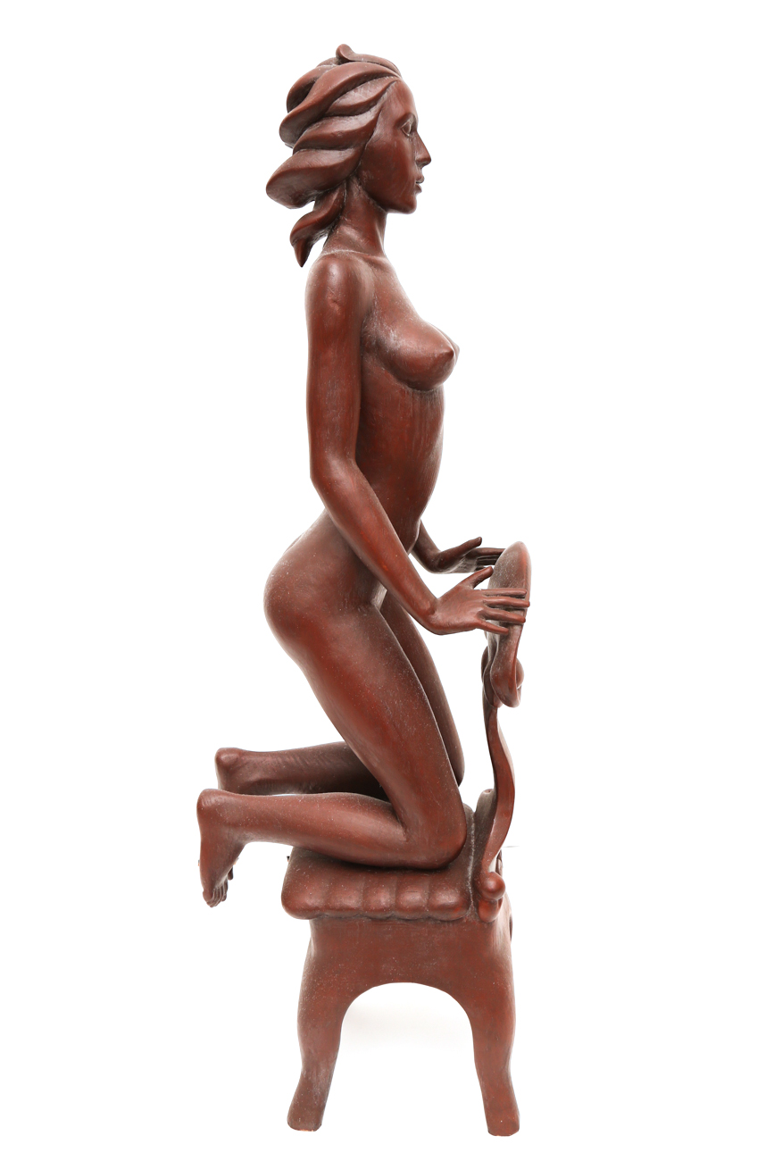 Hand Carved Sculpture Of A Female Kneeling