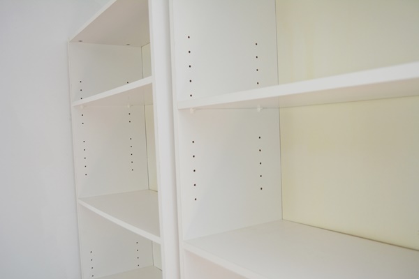 Two White Laminate Bookcase, Two Mobile Files, and a Desk