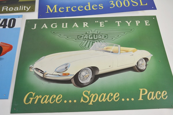 Seven Vintage Race Car Advertising Signs