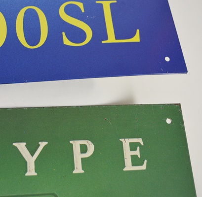 Seven Vintage Race Car Advertising Signs