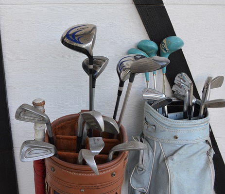 Two Sets of Golf Clubs and Golf Bags