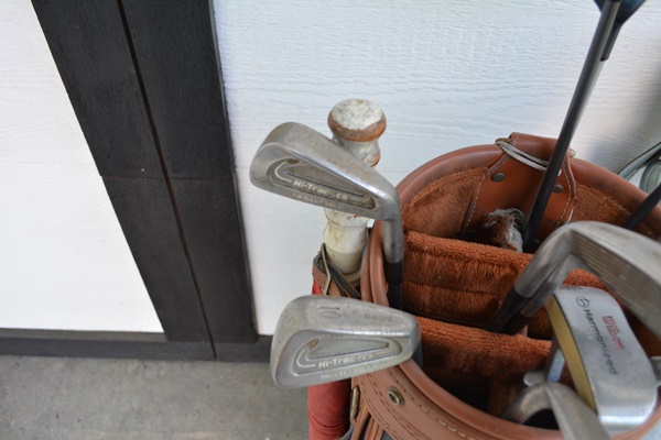 Two Sets of Golf Clubs and Golf Bags