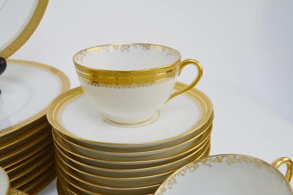 Ten Place Settings of Limoges Gold and White China