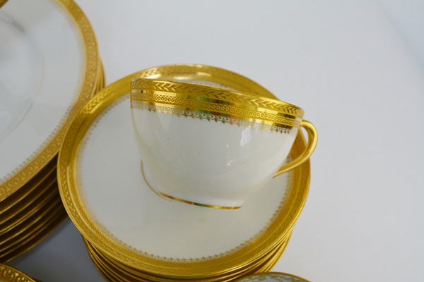 Ten Place Settings of Limoges Gold and White China