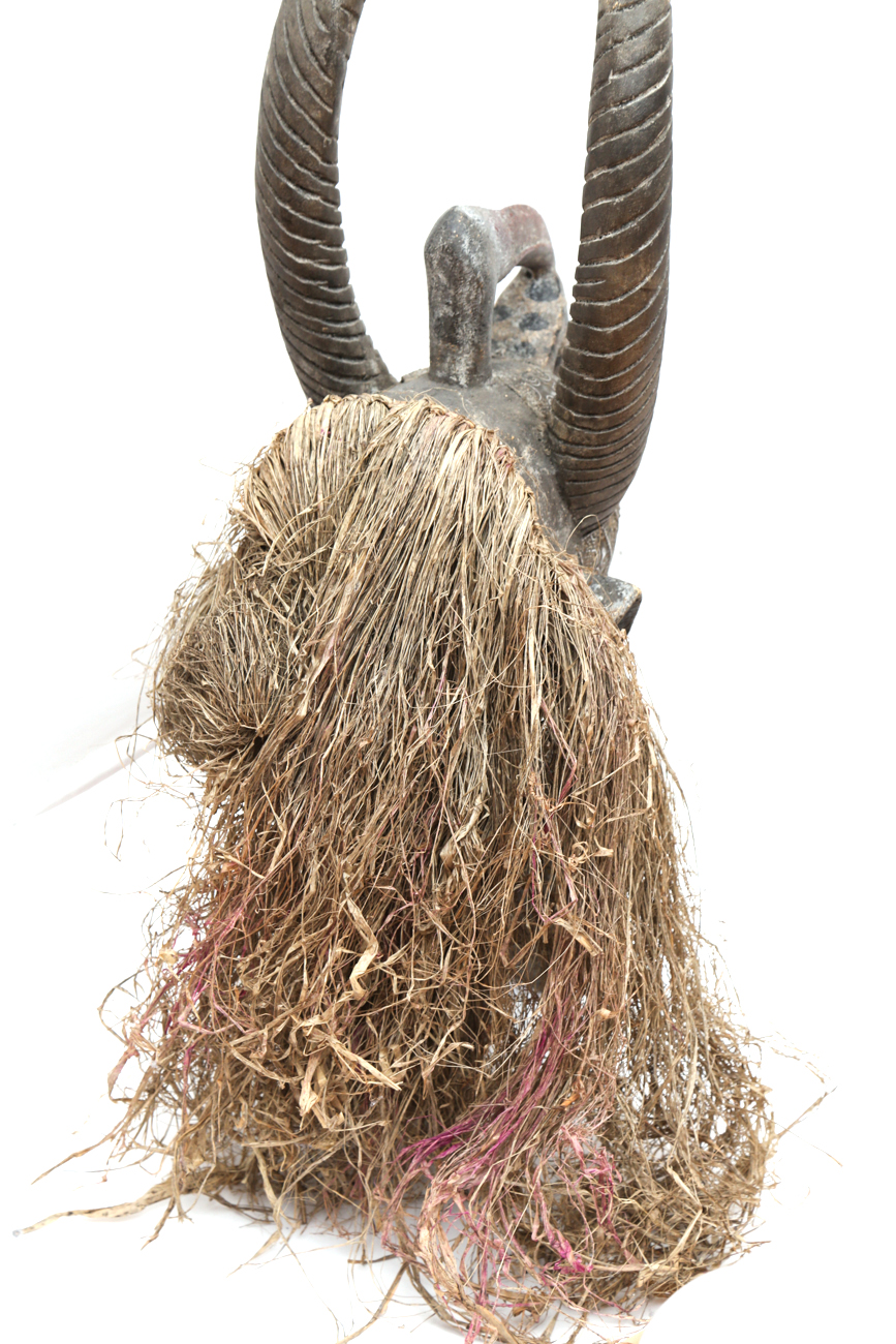 Hand Carved Tribal Head With Straw And Metal