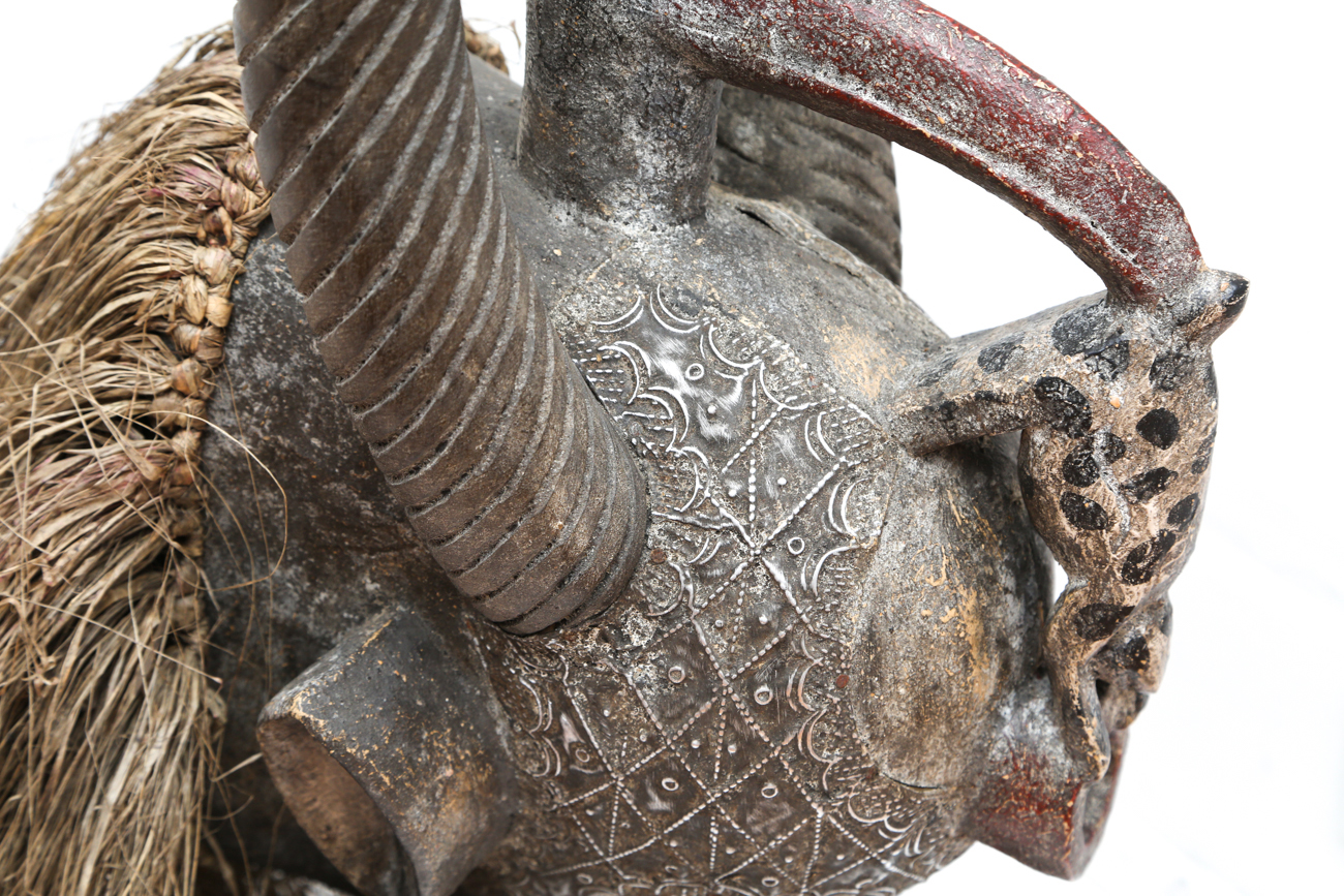 Hand Carved Tribal Head With Straw And Metal