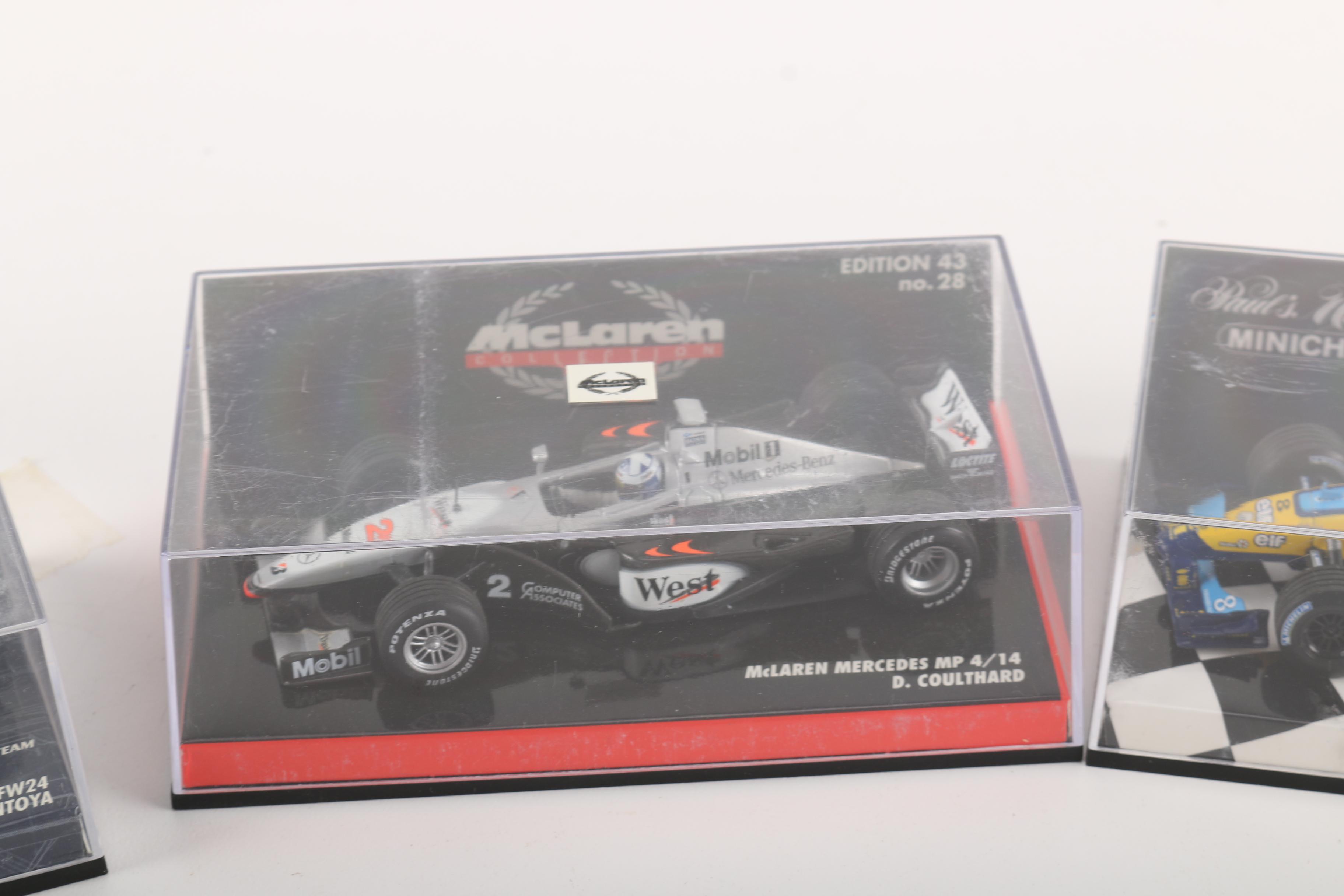 Collection of 1996 Model Helmets and F1 Cars From Various F1 Drivers