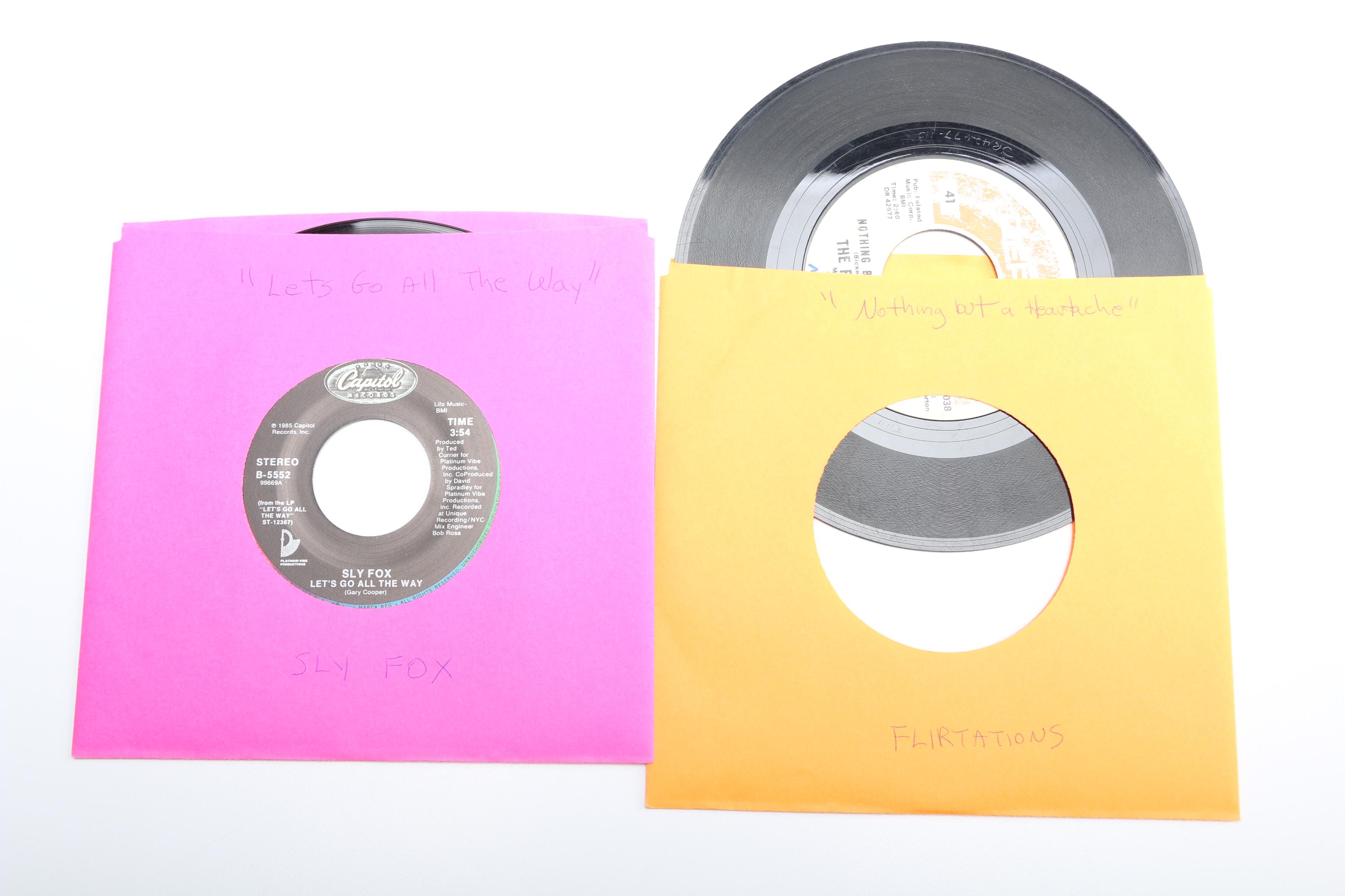 Vintage 45 RPM Cases With Records Including ELO and Fleetwood Mac