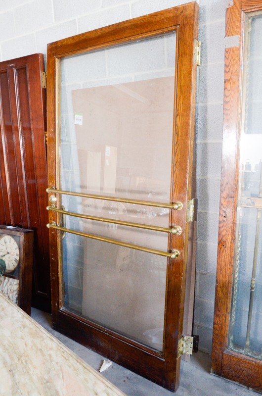 Glass Paneled Door with Brass Hardware from Clyde's of Georgetow