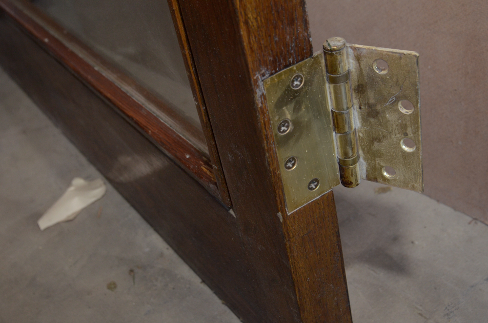 Glass Paneled Door with Brass Hardware from Clyde's of Georgetow