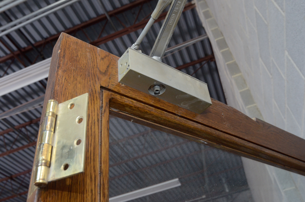 Glass Paneled Door with Brass Hardware from Clyde's of Georgetow