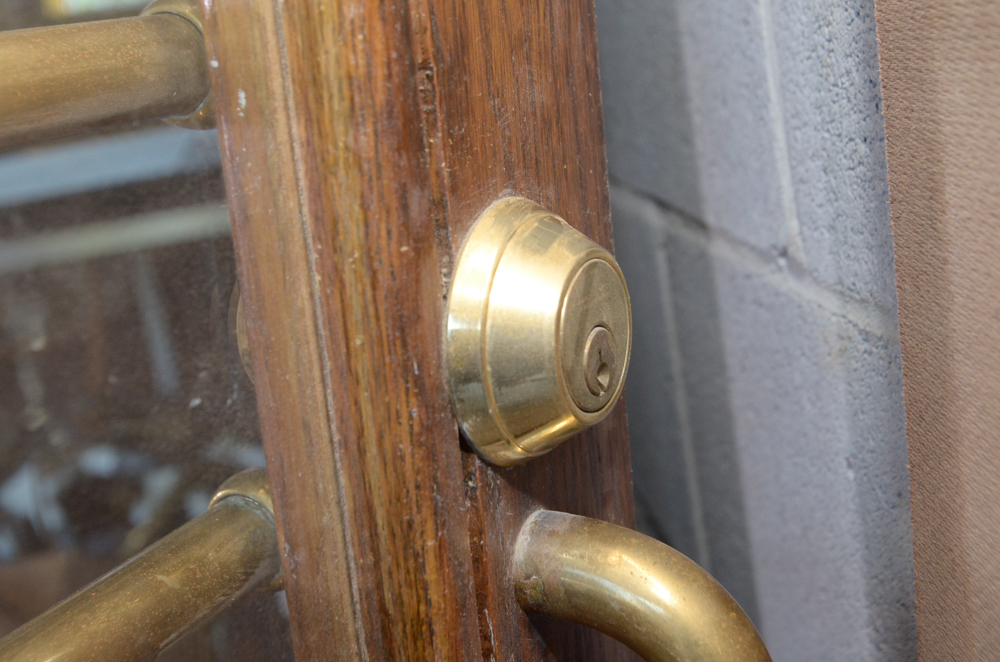 Glass Paneled Door with Brass Hardware from Clyde's of Georgetow
