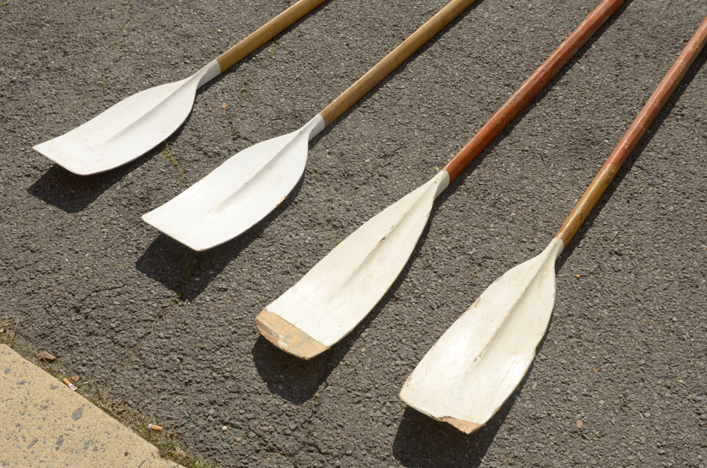 Collection of Vintage Rowing Oars with White Blades