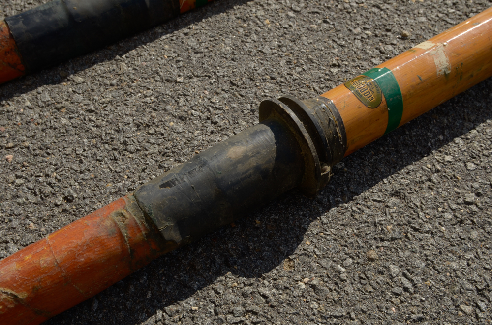 Collection of Vintage Rowing Oars with White Blades