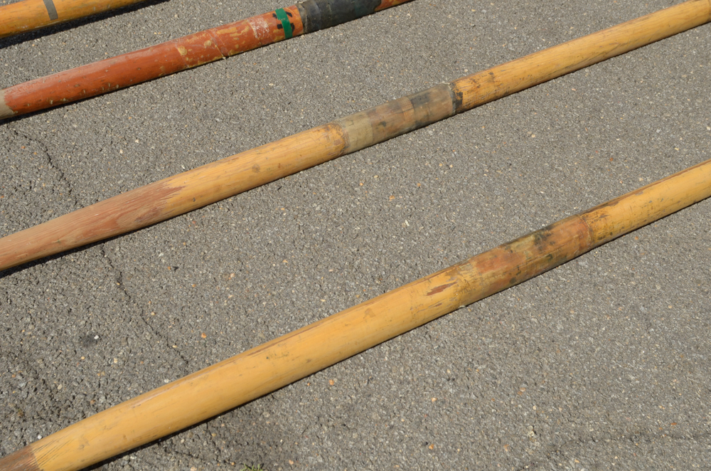 Collection of Vintage Rowing Oars with White Blades