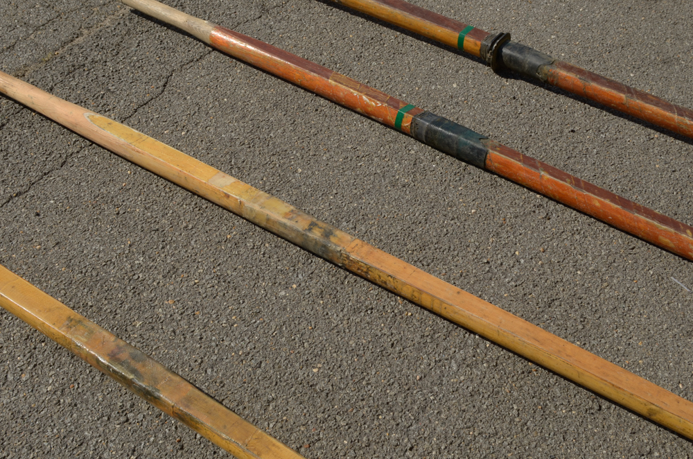 Collection of Vintage Rowing Oars with White Blades