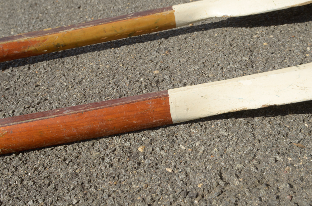 Collection of Vintage Rowing Oars with White Blades