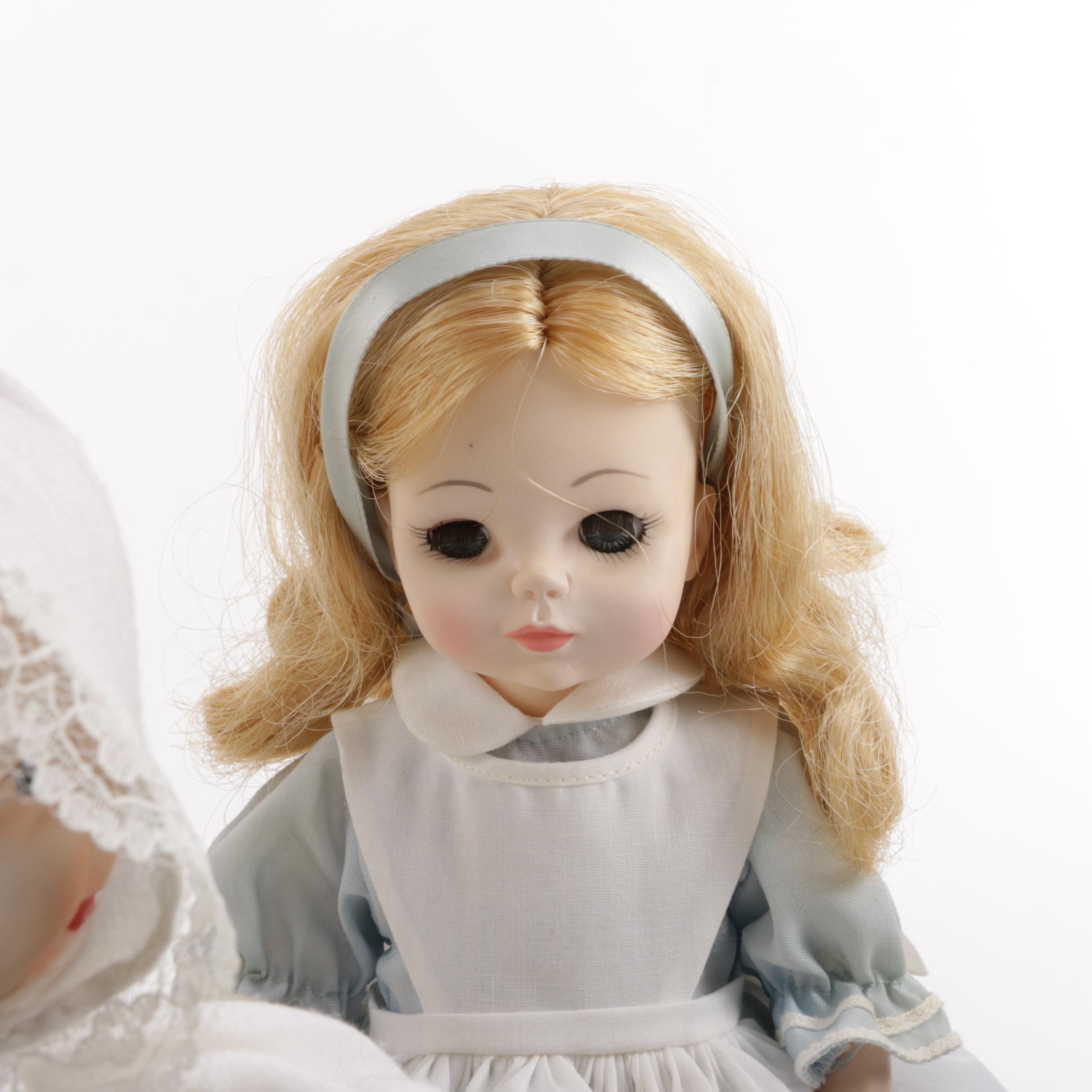Doll Collection Including Madame Alexander, a Pierrot, and a Three-Faced Baby Doll