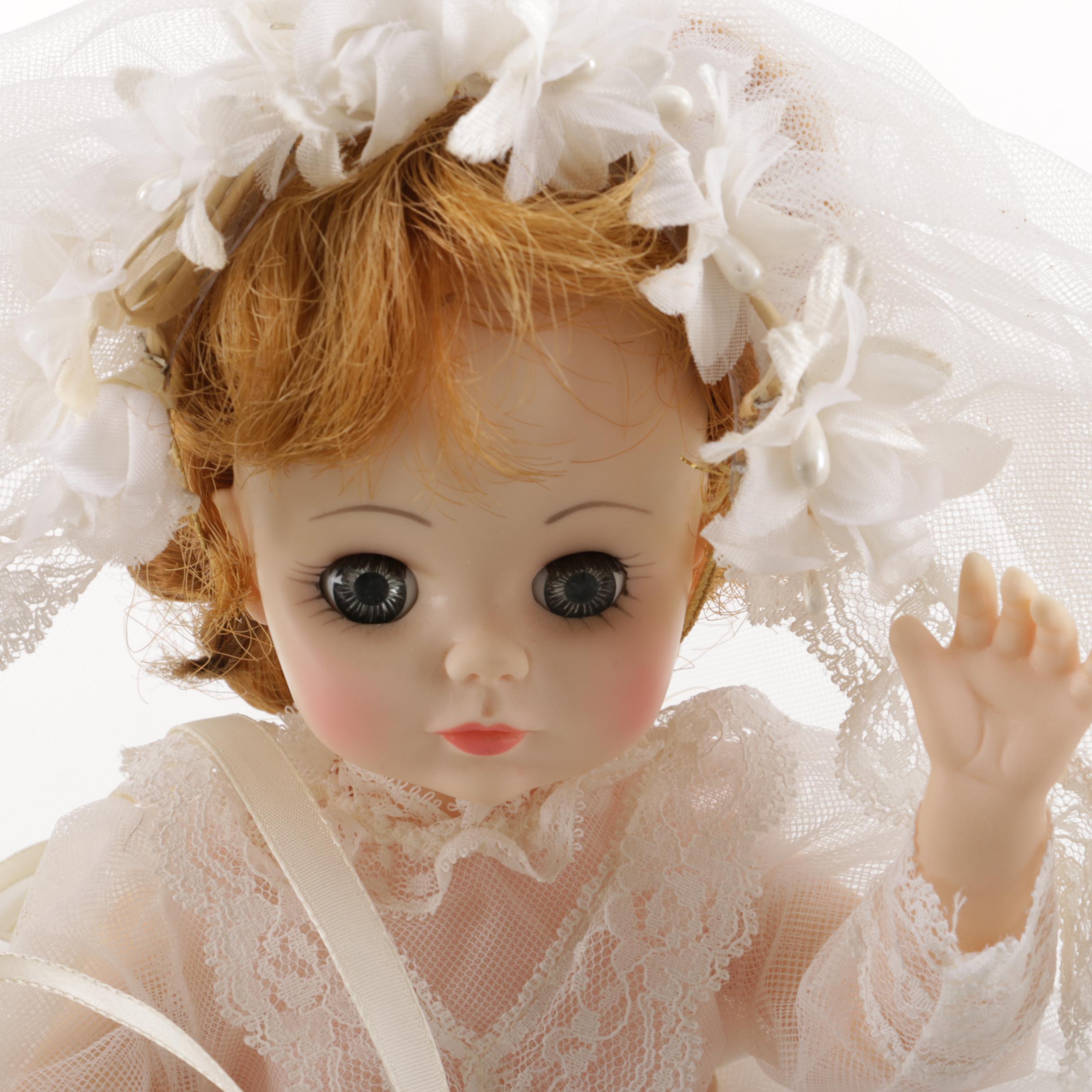 Doll Collection Including Madame Alexander, a Pierrot, and a Three-Faced Baby Doll