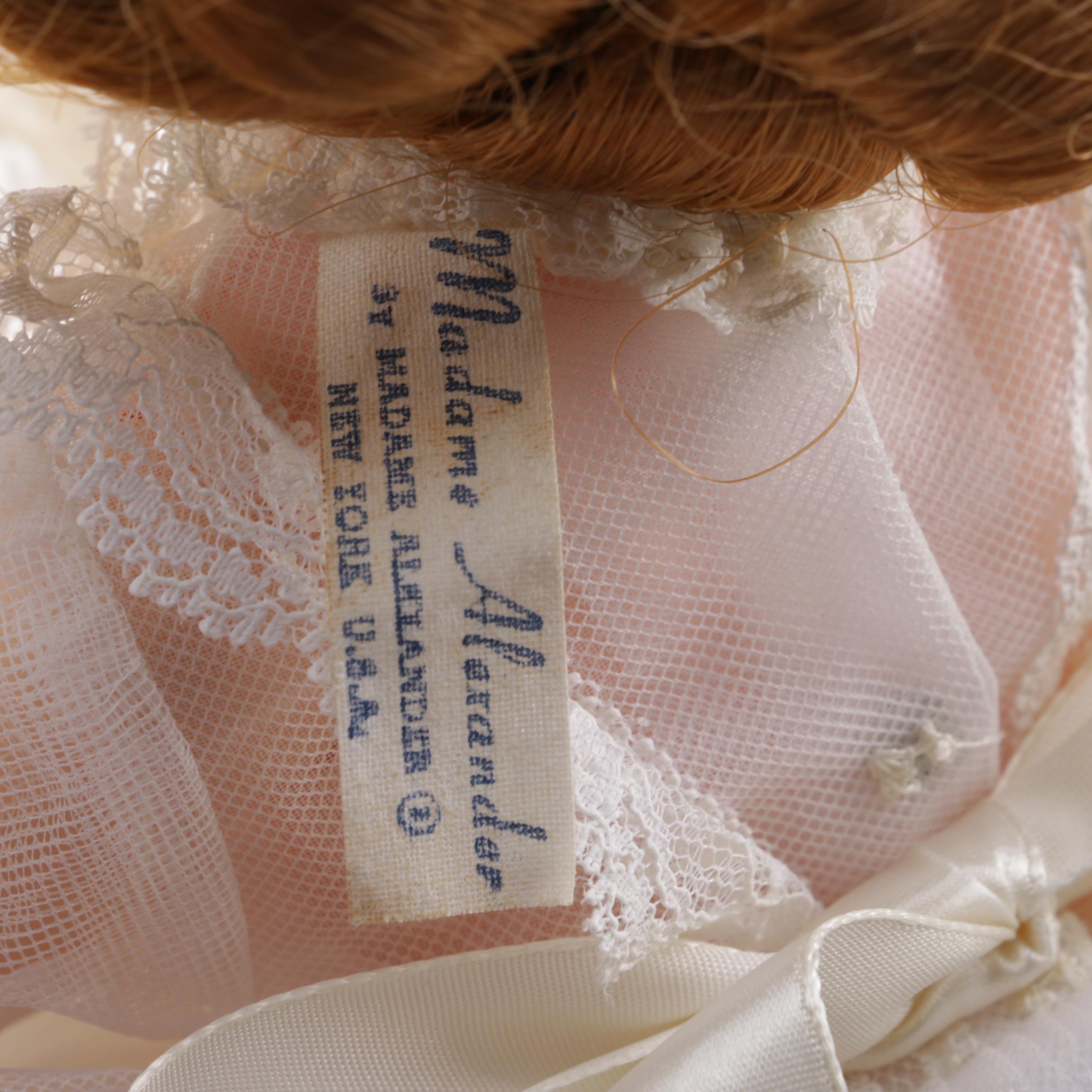 Doll Collection Including Madame Alexander, a Pierrot, and a Three-Faced Baby Doll