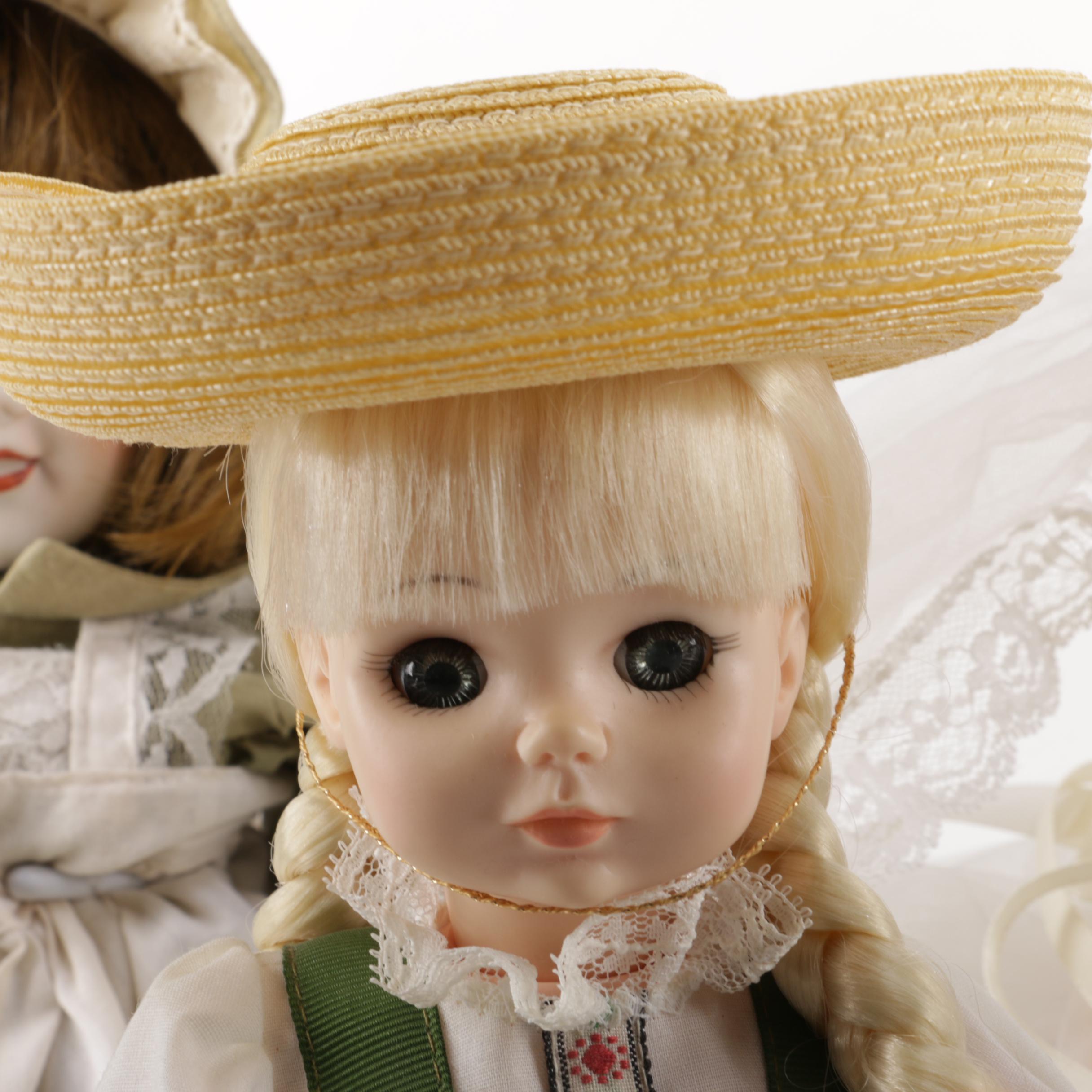 Doll Collection Including Madame Alexander, a Pierrot, and a Three-Faced Baby Doll