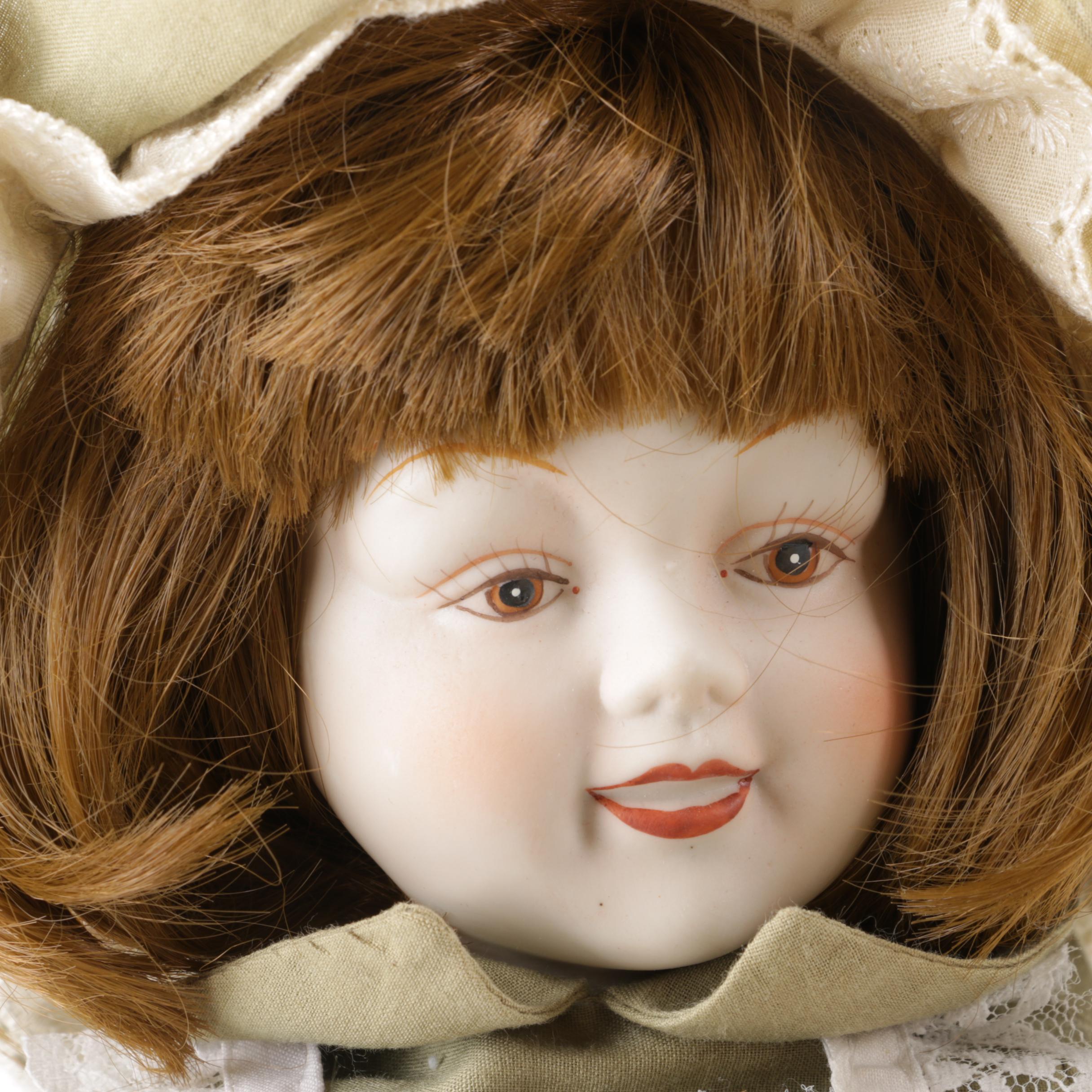 Doll Collection Including Madame Alexander, a Pierrot, and a Three-Faced Baby Doll