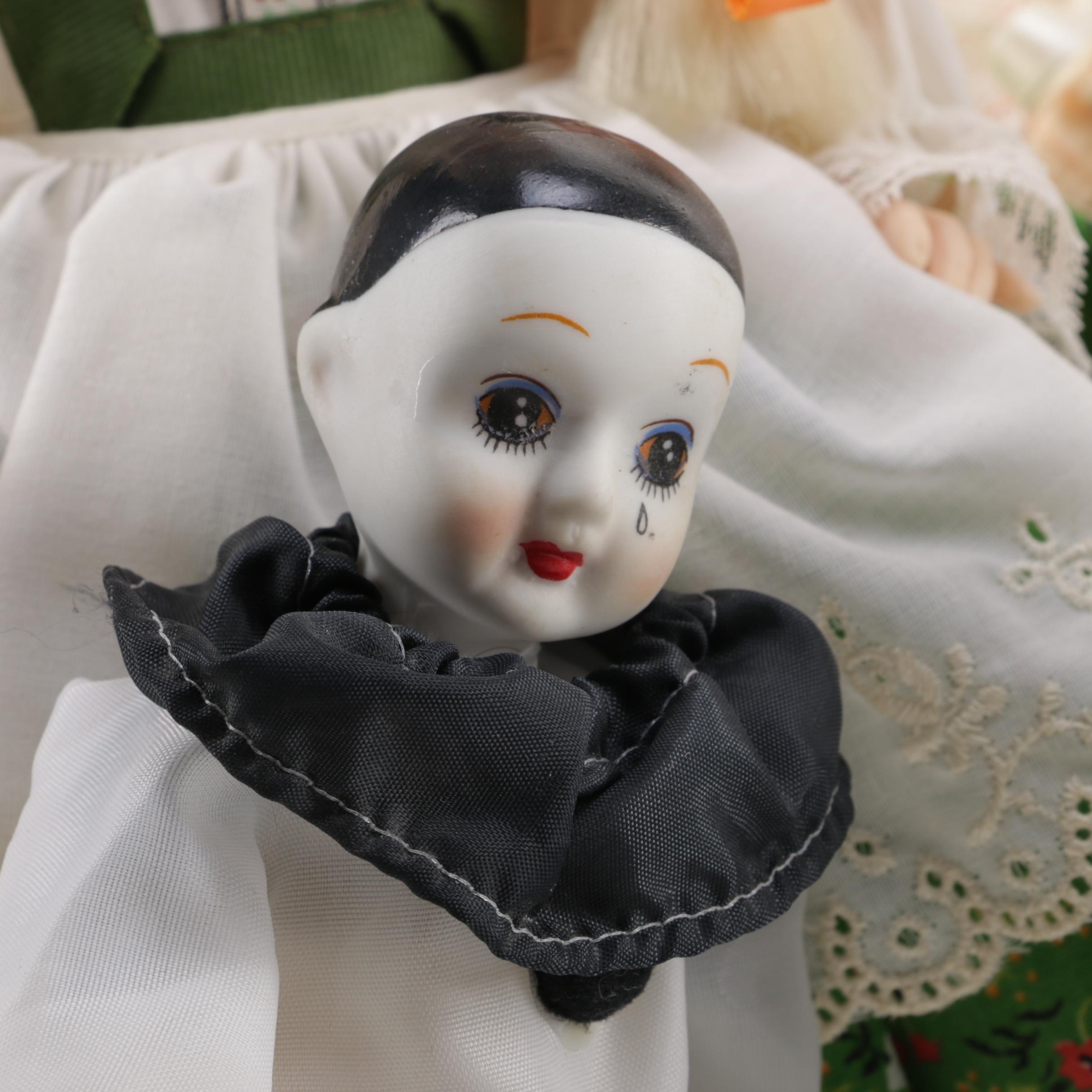 Doll Collection Including Madame Alexander, a Pierrot, and a Three-Faced Baby Doll