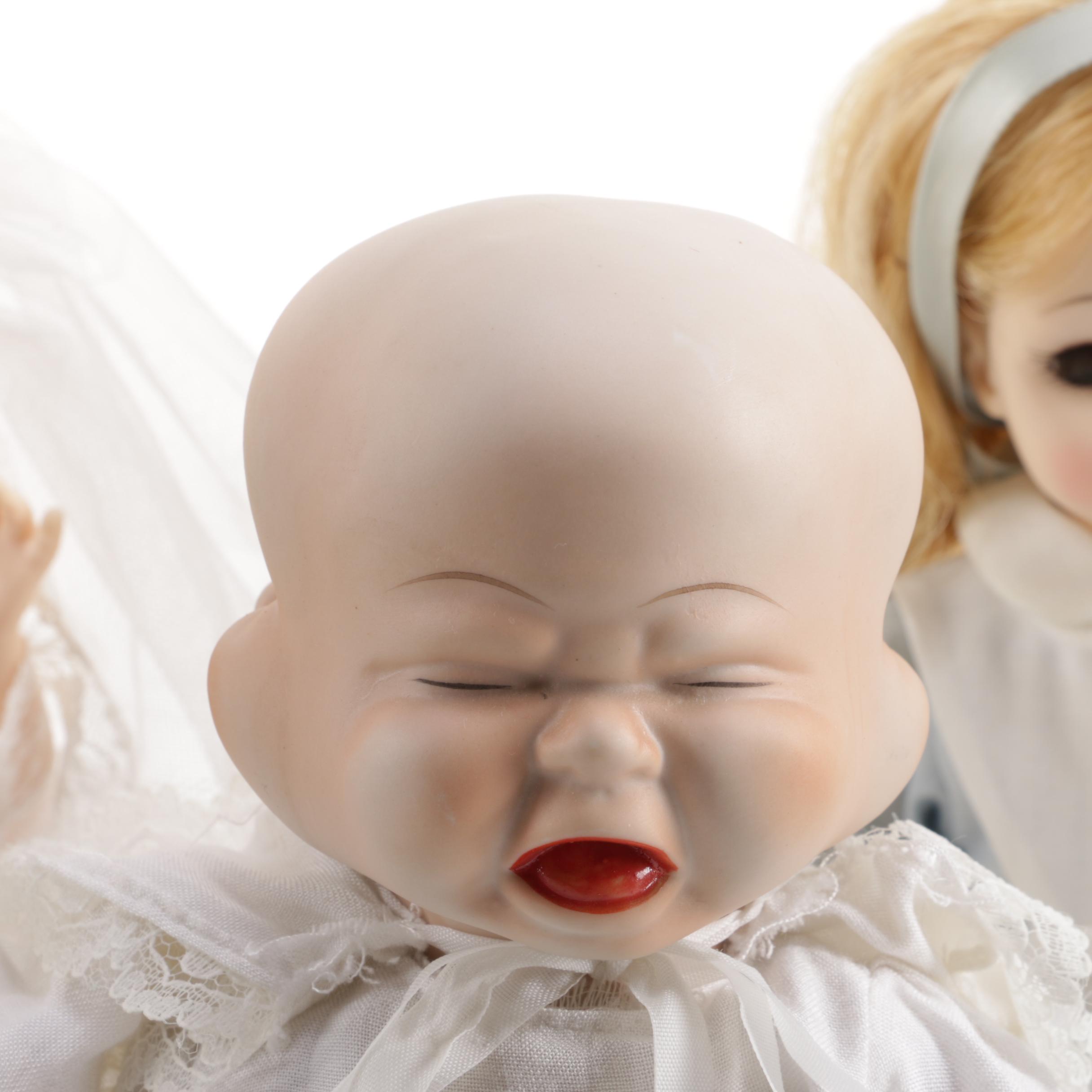 Doll Collection Including Madame Alexander, a Pierrot, and a Three-Faced Baby Doll