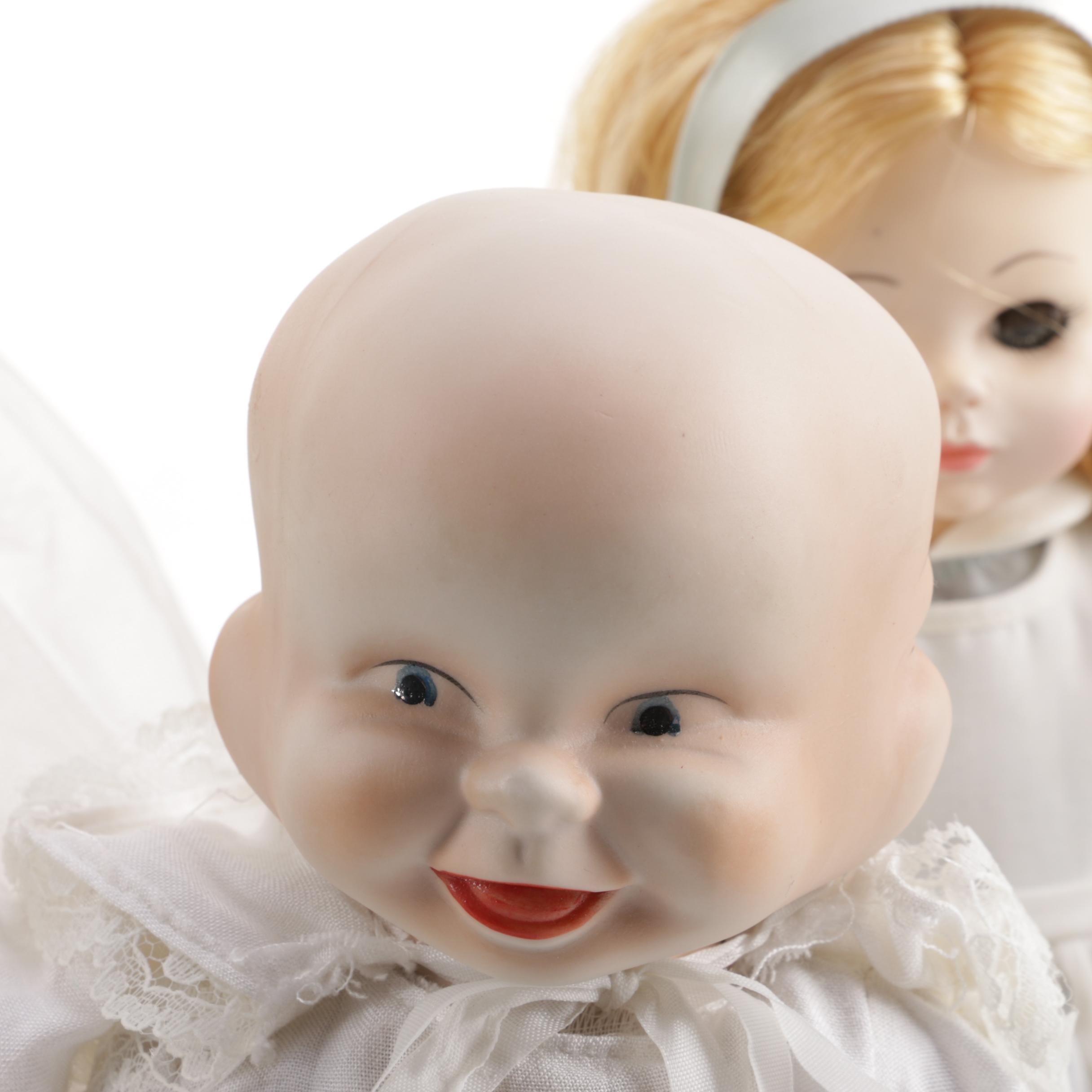 Doll Collection Including Madame Alexander, a Pierrot, and a Three-Faced Baby Doll