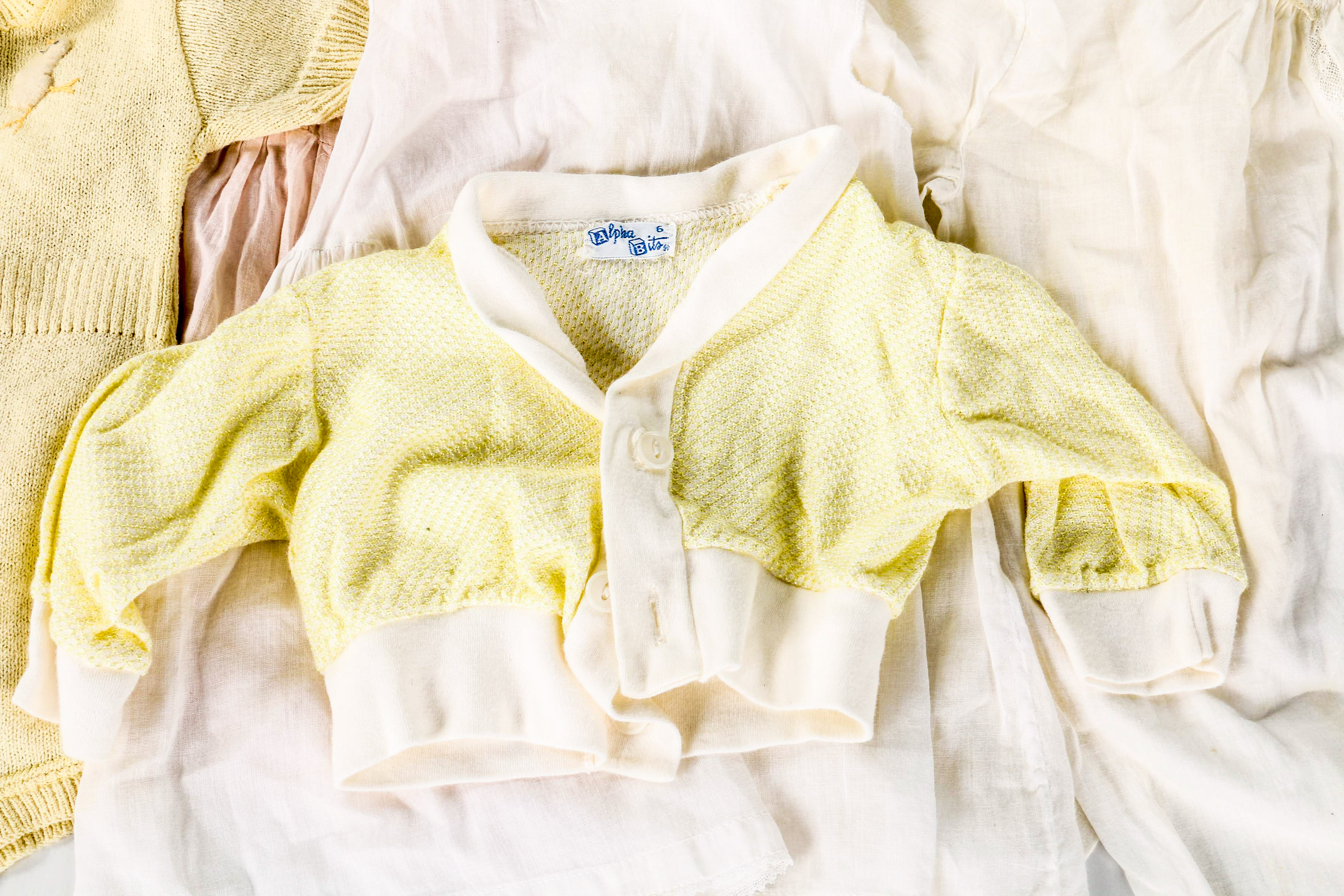Assortment of Baby Clothes and Booties