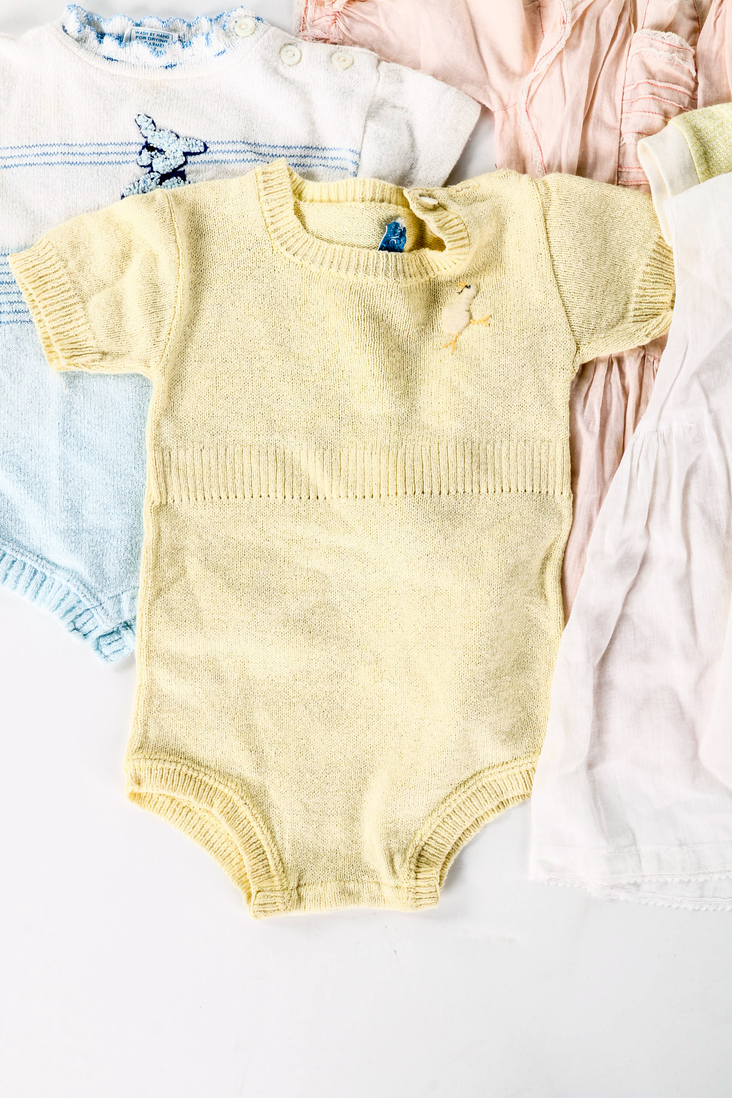 Assortment of Baby Clothes and Booties