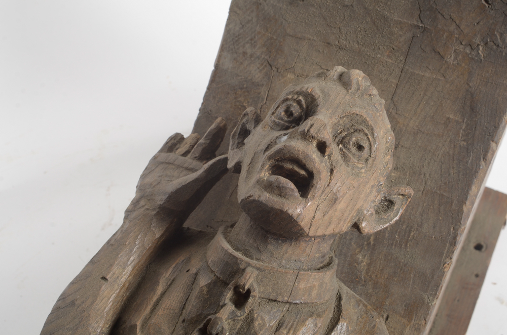 Hand Carved Wooden Bracket with Imprisoned Man