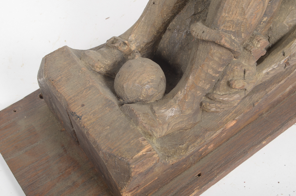Hand Carved Wooden Bracket with Imprisoned Man