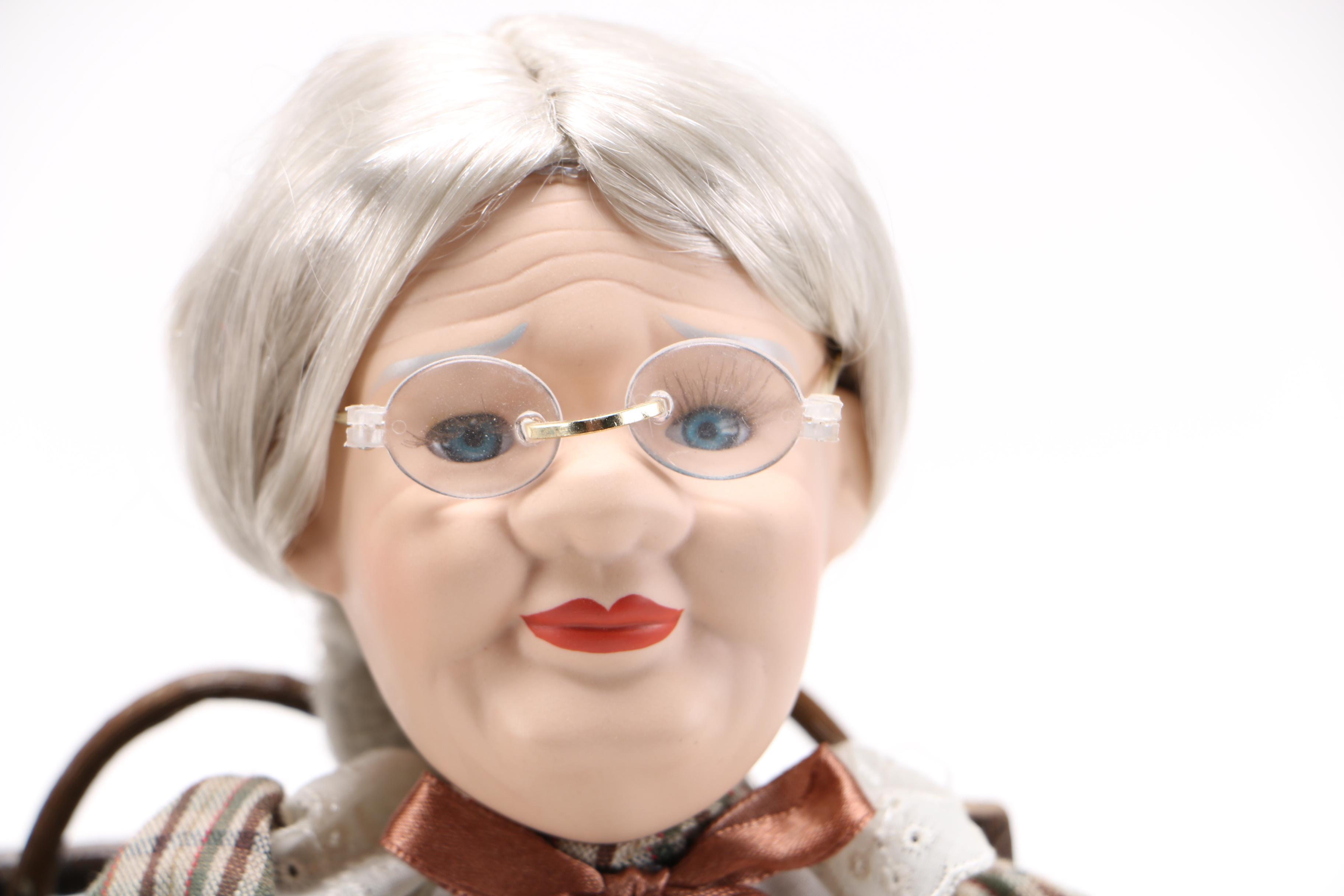 Dolls of Elderly Couple on a Heart Cane Bench