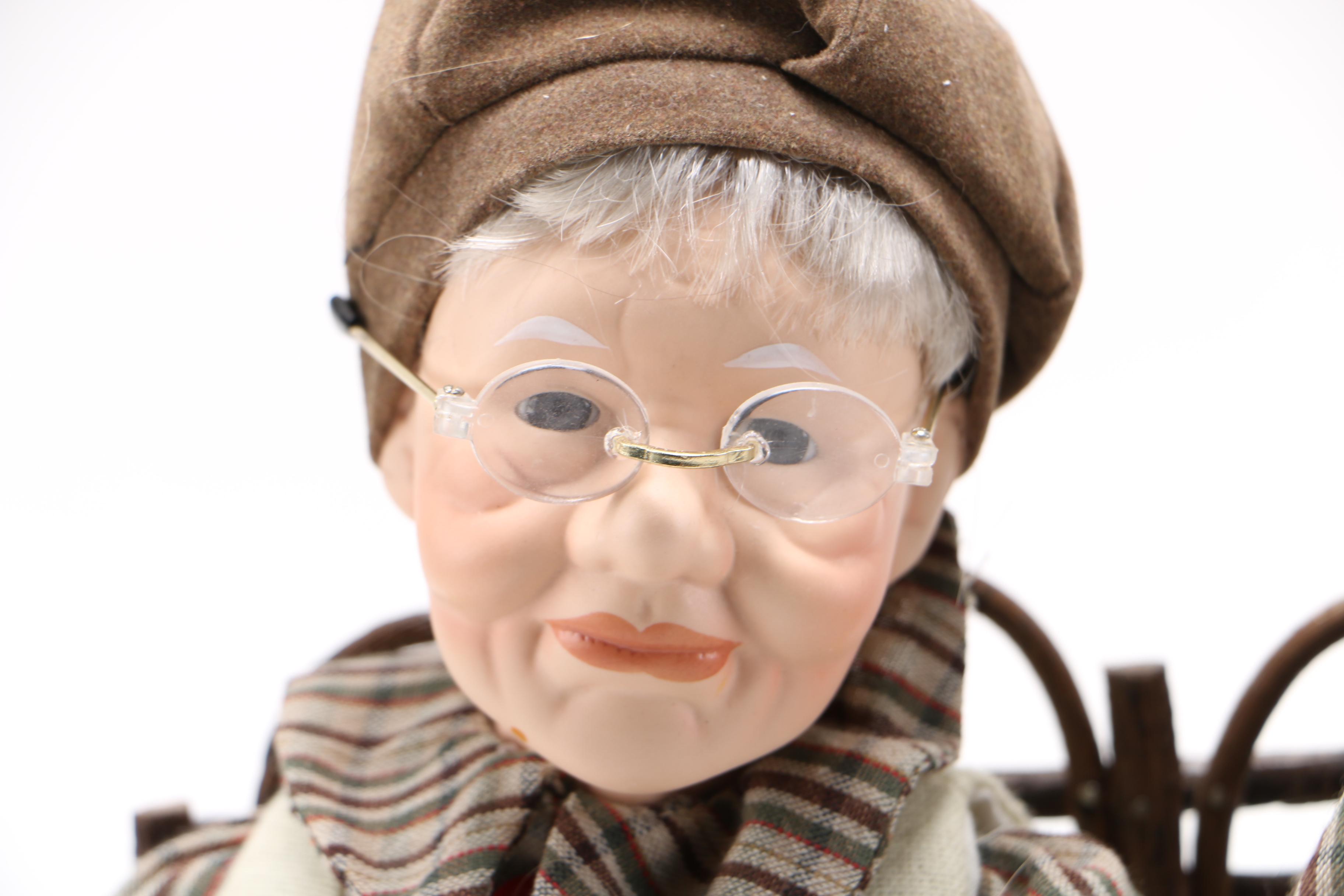 Dolls of Elderly Couple on a Heart Cane Bench