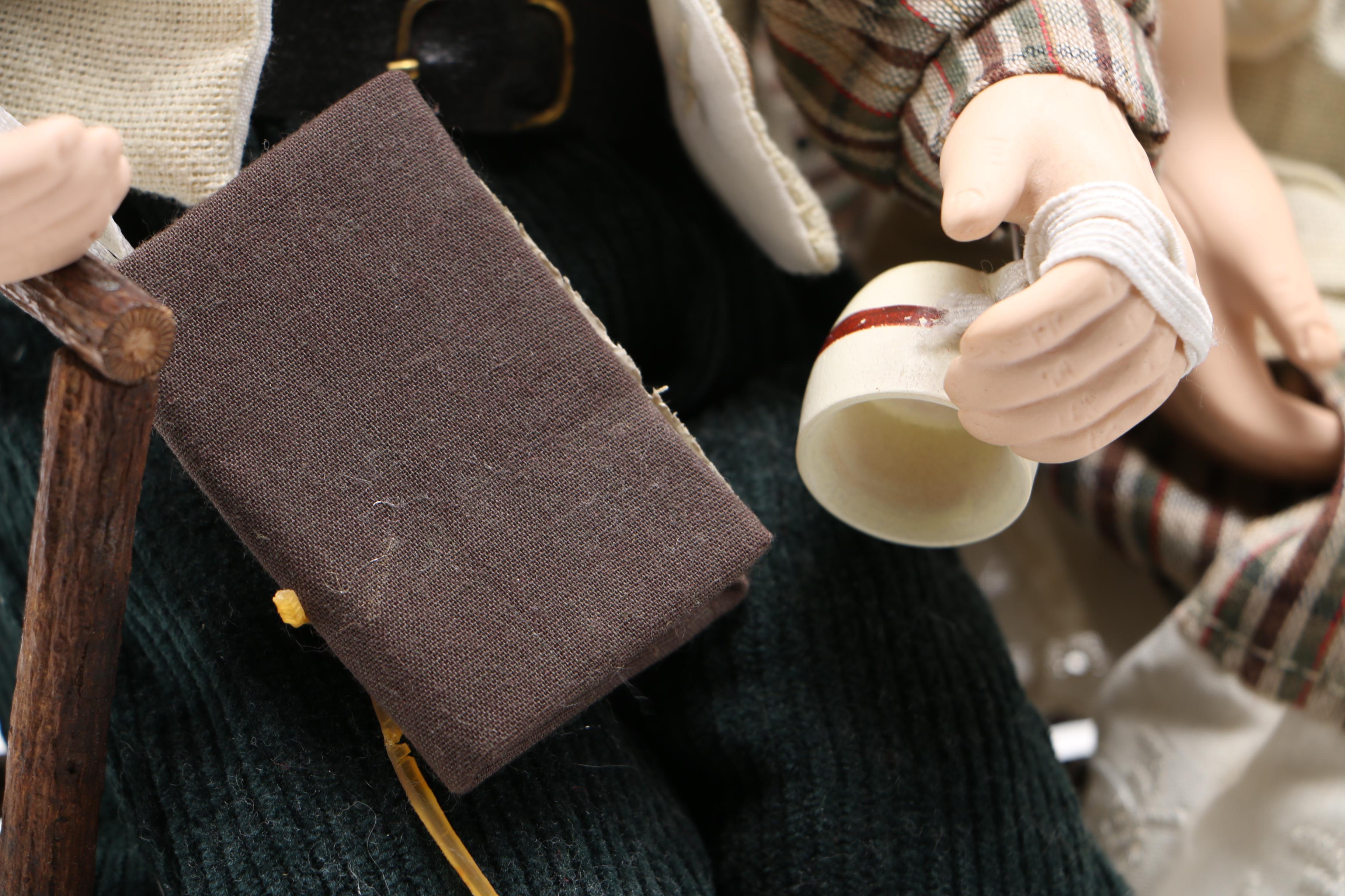 Dolls of Elderly Couple on a Heart Cane Bench