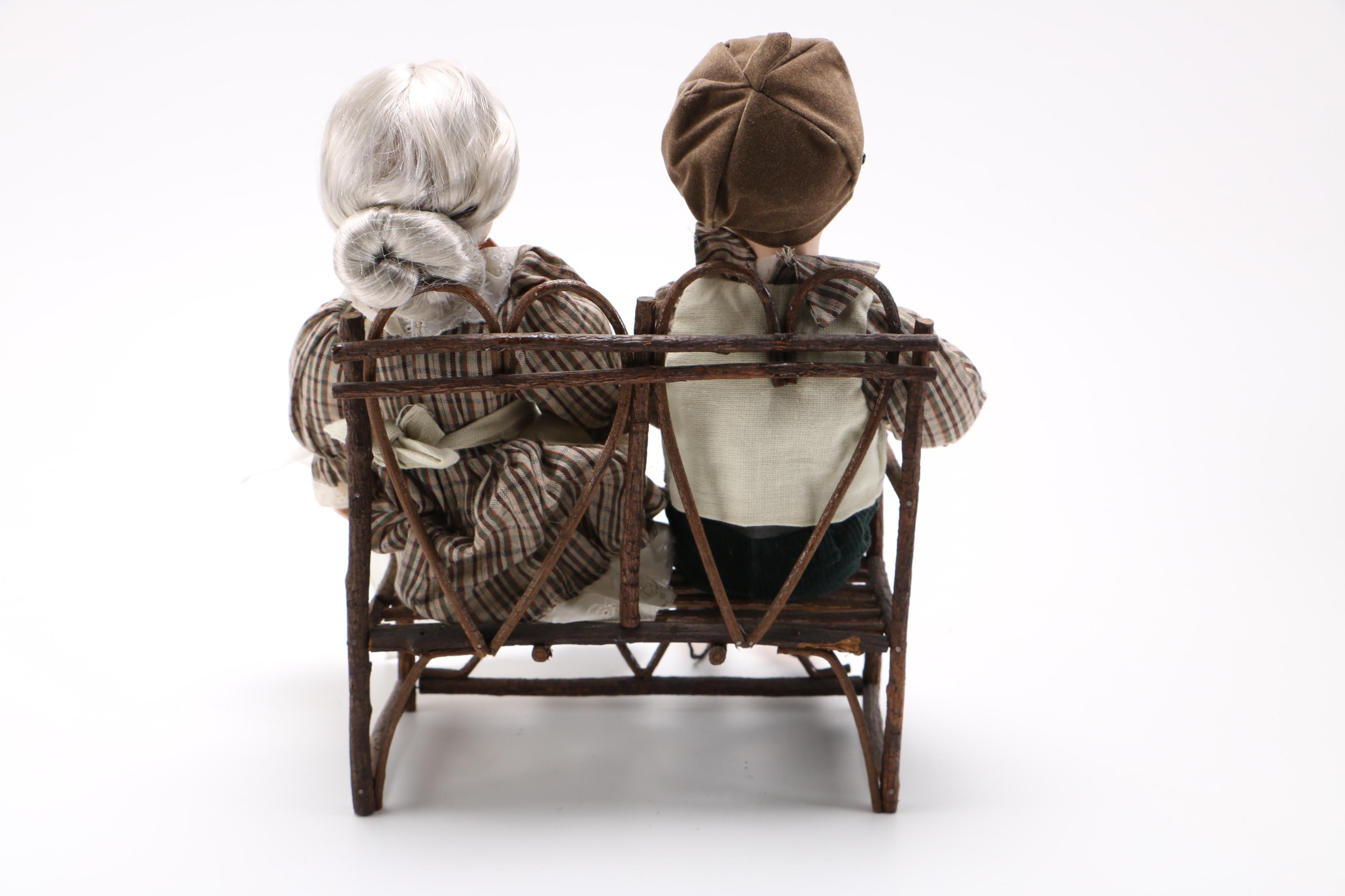 Dolls of Elderly Couple on a Heart Cane Bench