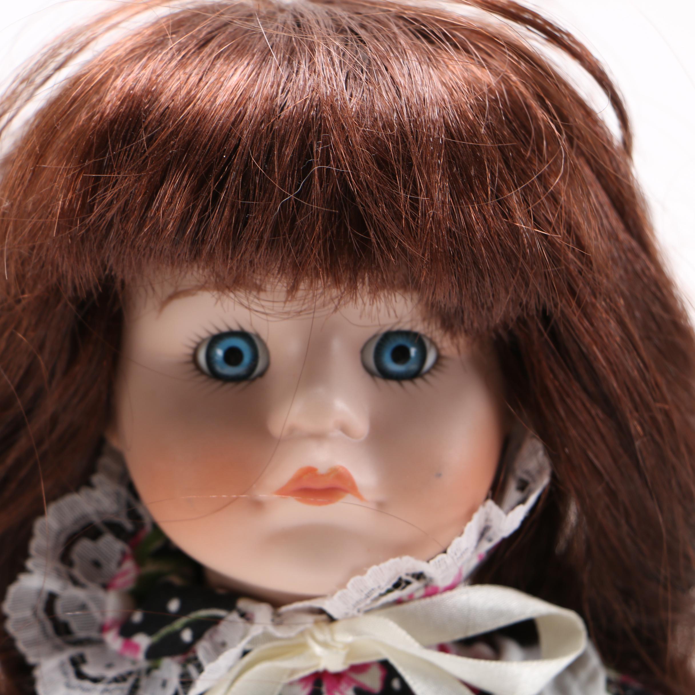 Four Porcelain Collector Dolls